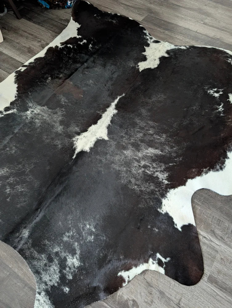 Extra large reddish black and white cowhide rug with natural fur texture large cowhide for stylish decor