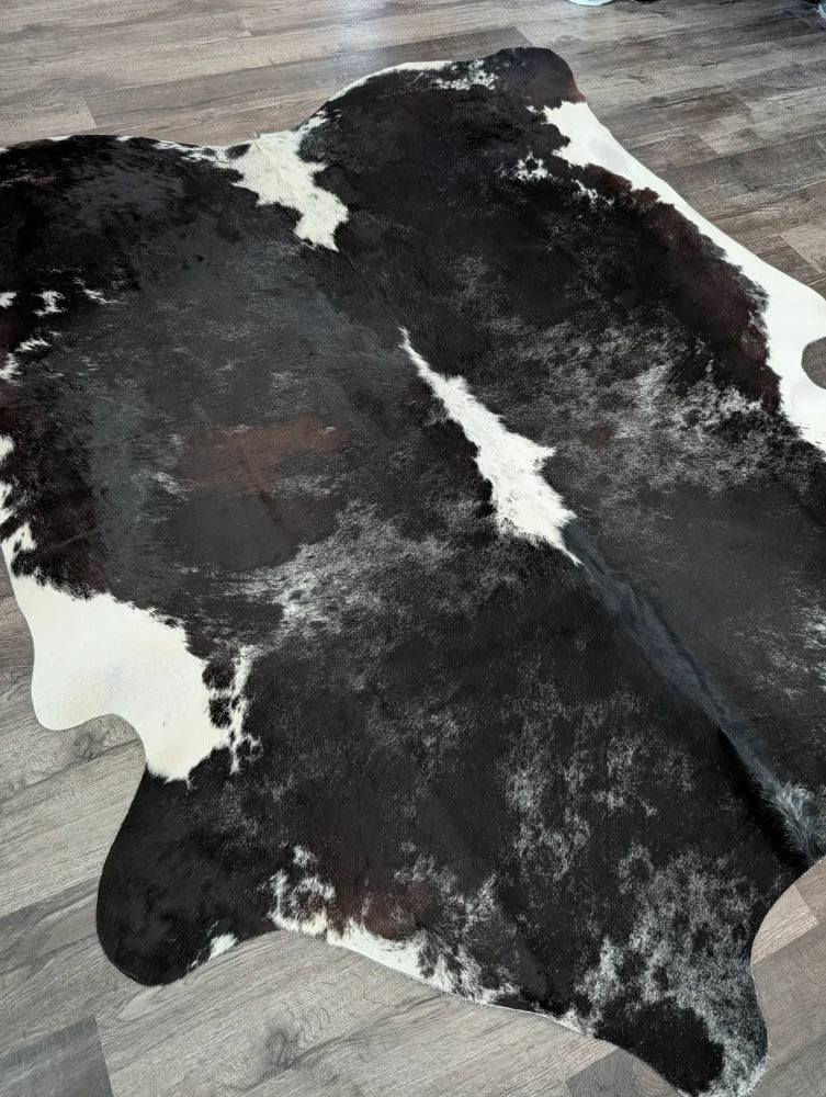 Extra large black and white cowhide rug reddish 476 with natural irregular patterns 89 by 77 inches large cowhide