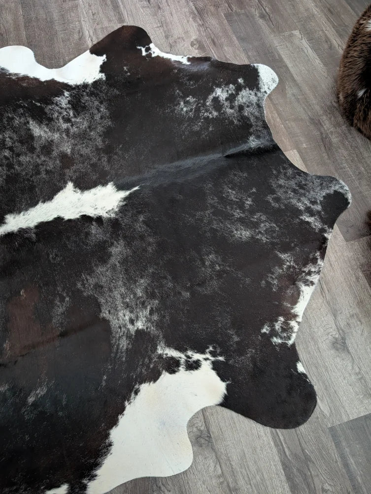 Black and white large cowhide rug with natural irregular edges extra large reddish 476 89 by 77 inches