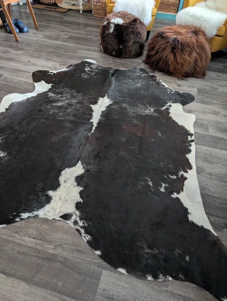 Reddish#476 extra large black and white cowhide rug with natural irregular patterns perfect for large cowhide decor