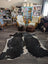 Reddish 476 extra large black and white cowhide rug with natural irregular patterns measuring 89 by 77 inches