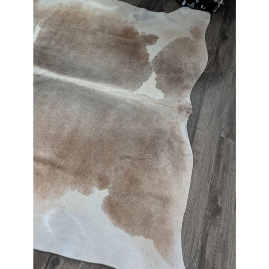 Reddish 498 extra large cowhide rug with natural tones soft texture and irregular light brown creamy white patches