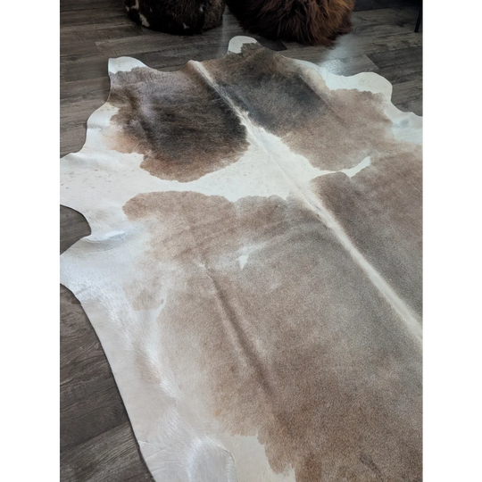 Reddish 498 extra large cowhide rug with natural brown and white irregular patches perfect as a large cowhide centerpiece