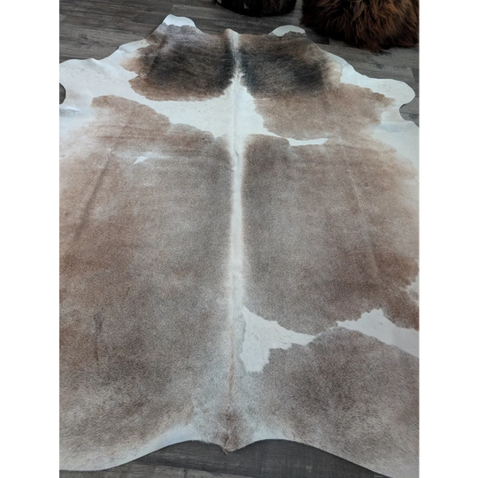 Reddish 498 extra large cowhide rug in brown and white with natural fur texture perfect for large cowhide decor