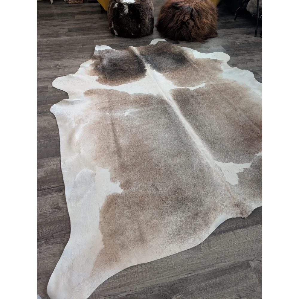Reddish 498 extra large cowhide rug with soft textured surface in natural tones of white beige and brown large cowhide