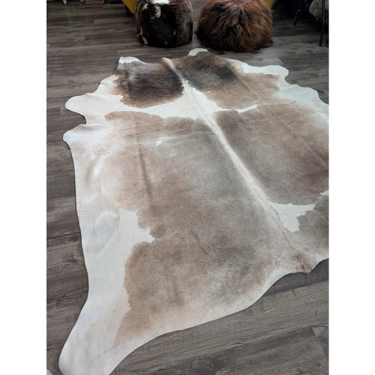 Reddish 498 extra large cowhide rug with soft textured surface in natural tones of white beige and brown large cowhide