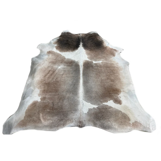 Natural-toned extra large cowhide rug with brown gray and white patches perfect for living room decor