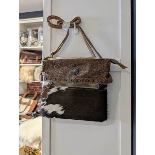 Remarkable hairon bag with brown leather floral tooled design, real cowhide patch