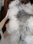 Fluffy grey sheepskin cushion with thick curly fur