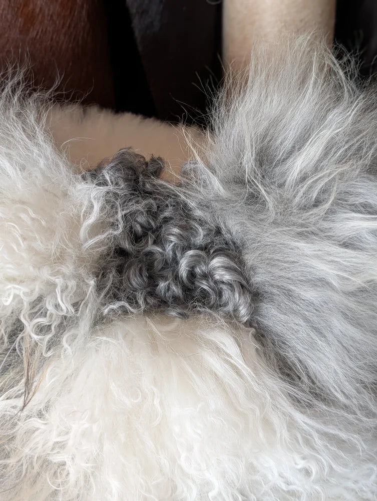 Ridiculously over the top grey sheepskin cushion in plush curly faux fur