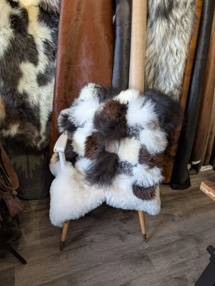 Ridiculously over the top checkered sheepskin cushion on wooden frame