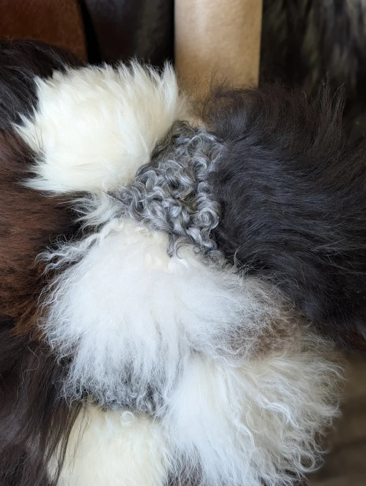 Ridiculously over the top sheepskin cushion plush multicolored fur bow