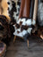 Cozy white chair with checkered sheepskin cushion and plush fur blanket
