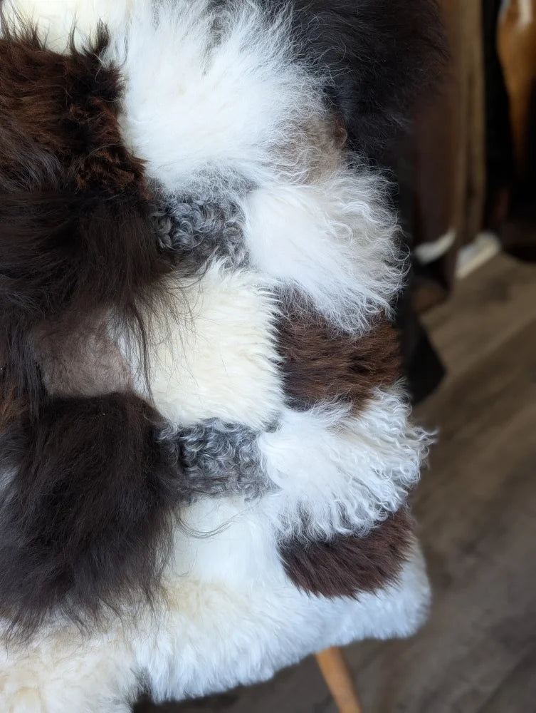 Ridiculously over the top checkered sheepskin cushion rug