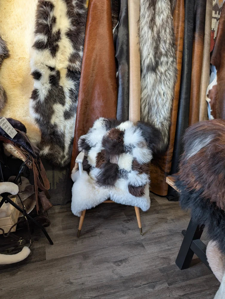 Ridiculously over the top checkered sheepskin cushion in patchwork fur design