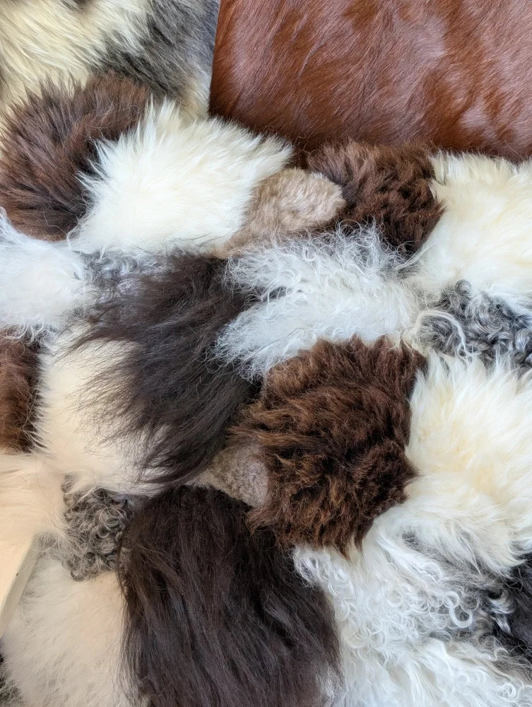 Ridiculously over the top checkered sheepskin cushion in fluffy patchwork