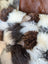 Ridiculously over the top checkered sheepskin cushion in fluffy patchwork