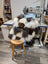 Ridiculously over the top checkered sheepskin cushion on wooden stool