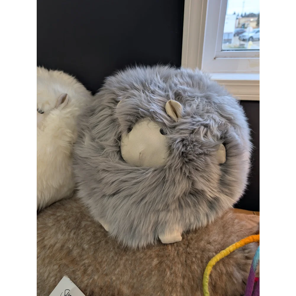 Cozy gray Rotund Sheepskin Cushion plush sheep with white face