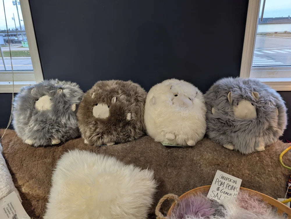 Cozy plush bunny sheepskin cushion in gray and white