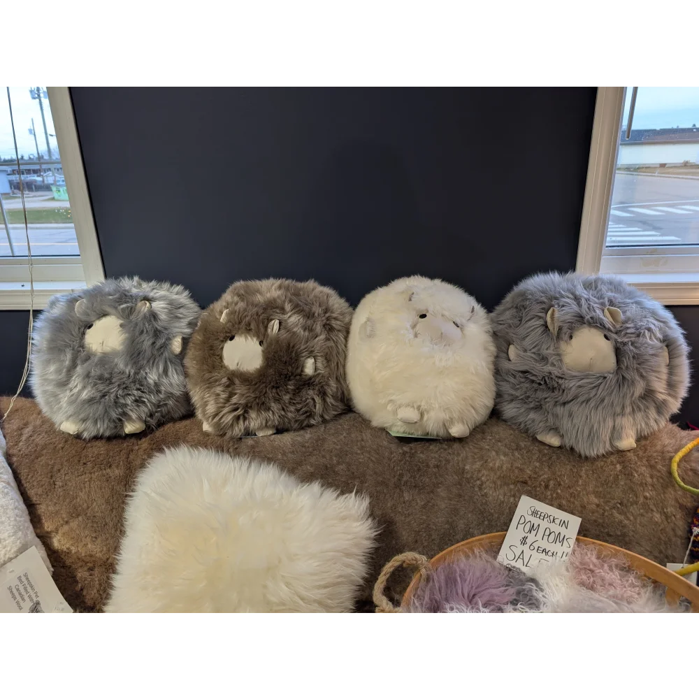 Cozy plush bunny sheepskin cushion in gray and white