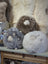 Cute fluffy gray white sheepskin cushion like a plush lamb