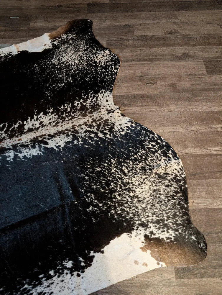 Extra large salt and pepper brown cowhide rug with natural edges perfect for beautiful rugs and large cowhides