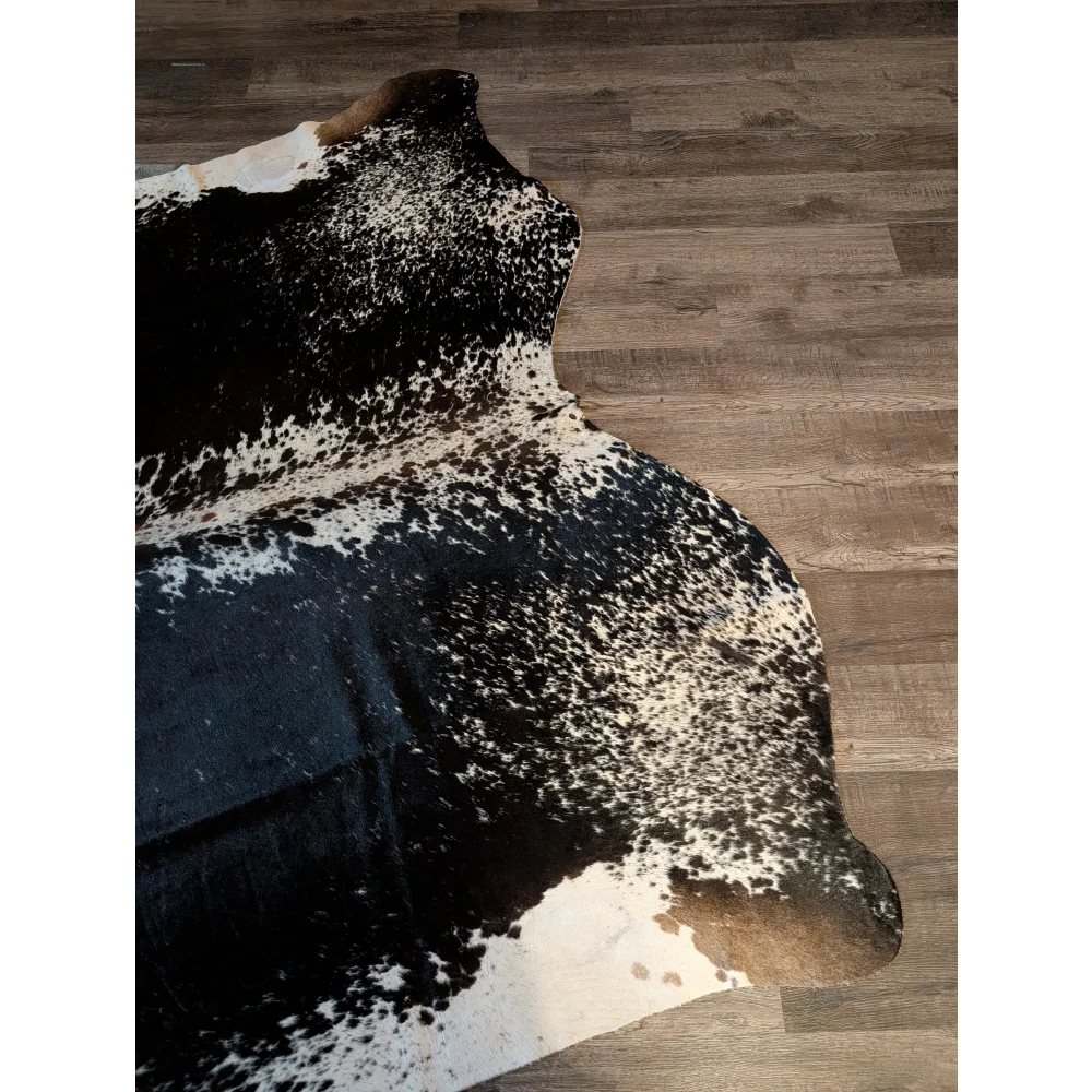 Extra large salt and pepper brown cowhide rug with natural edges perfect for beautiful rugs and large cowhides