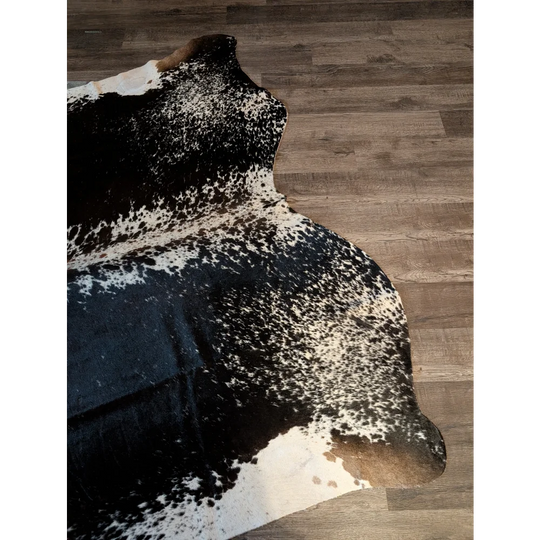 Extra large salt and pepper brown cowhide rug with natural edges perfect for beautiful rugs and large cowhides