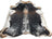 Salt & pepper brown large cowhide rug with black and white spots tan edges and a textured surface perfect for beautiful rugs