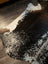 Salt and pepper brown extra large cowhide rug with black and white spots and natural irregular edges perfect for beautiful rugs