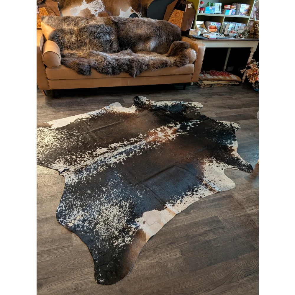A beautiful extra large black and white speckled cowhide rug salt and pepper brown perfect for large cowhide decor