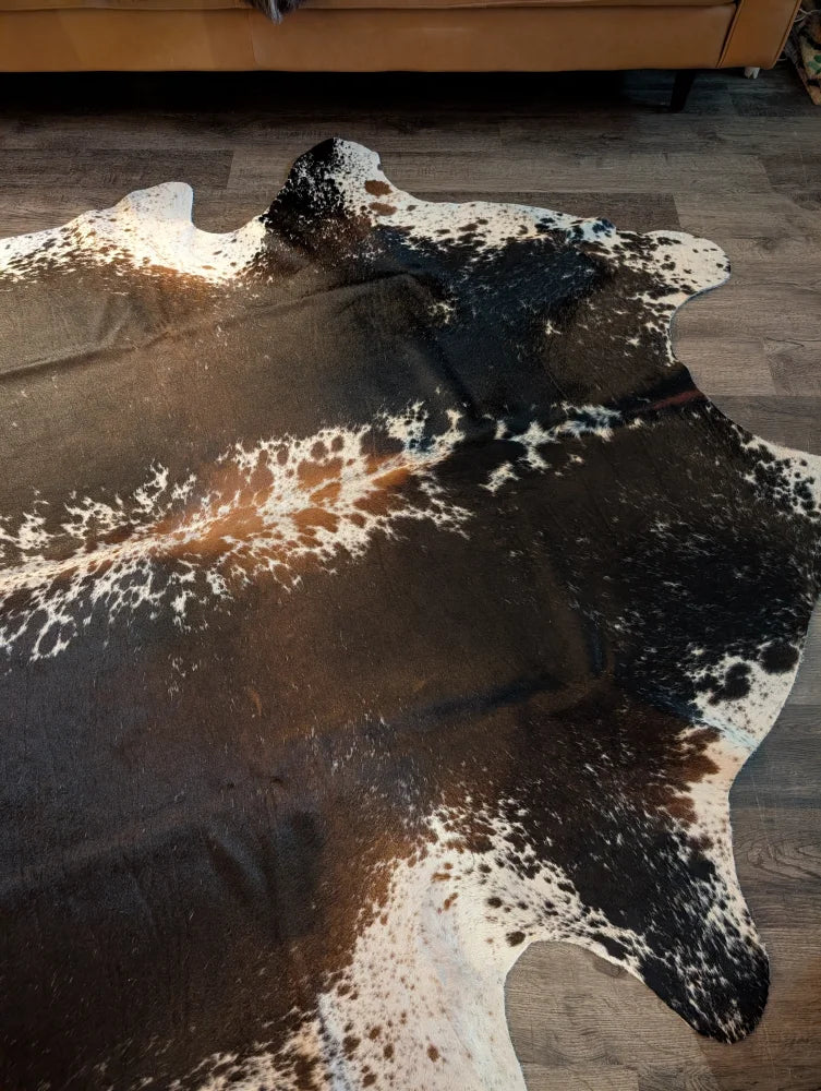 Extra large cowhide rug in salt and pepper brown with natural irregular patterns perfect for beautiful rugs and decor