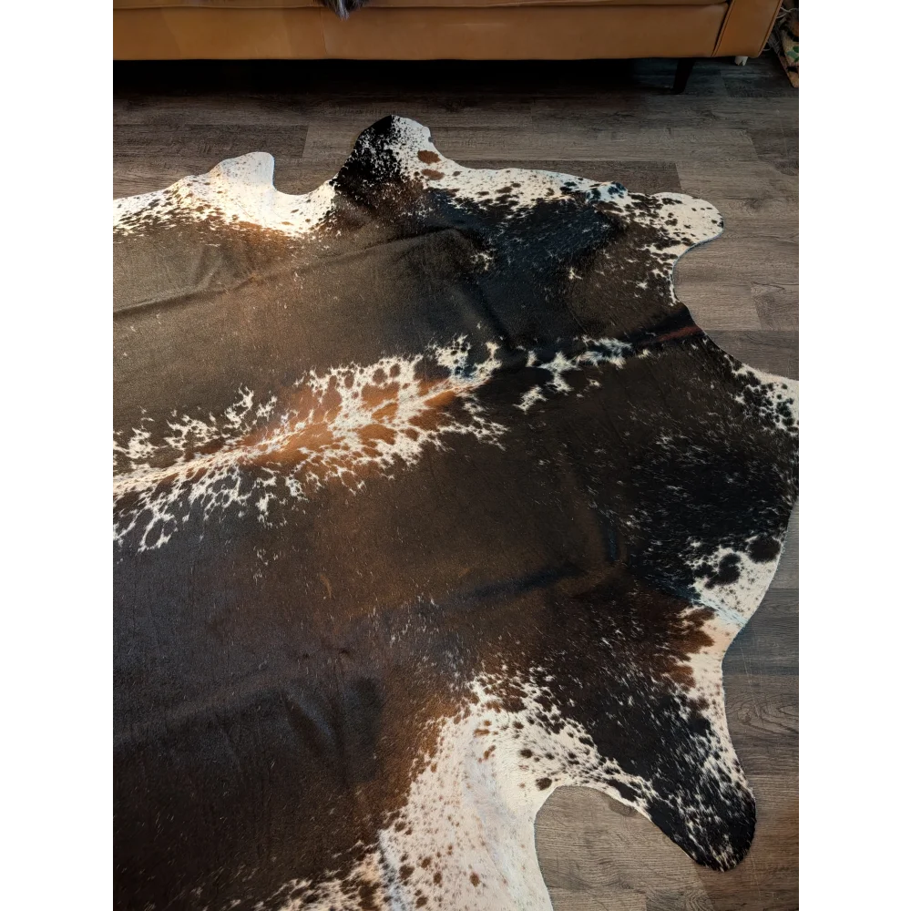 Extra large cowhide rug in salt and pepper brown with natural irregular patterns perfect for beautiful rugs and decor