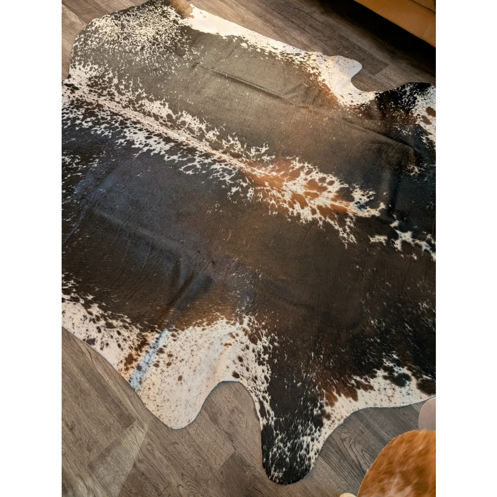 Beautiful extra large cowhide rug in salt and pepper brown with natural irregular patterns perfect for large cowhide decor