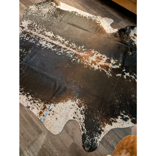 Beautiful extra large cowhide rug in salt and pepper brown with natural irregular patterns perfect for large cowhide decor