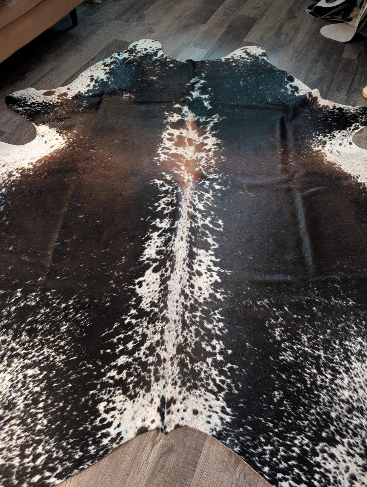 Salt and pepper brown extra large cowhide rug with natural black and white spotted pattern perfect for beautiful rugs