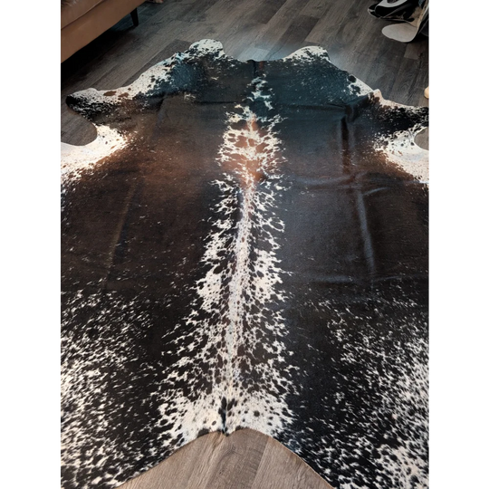 Salt and pepper brown extra large cowhide rug with natural black and white spotted pattern perfect for beautiful rugs