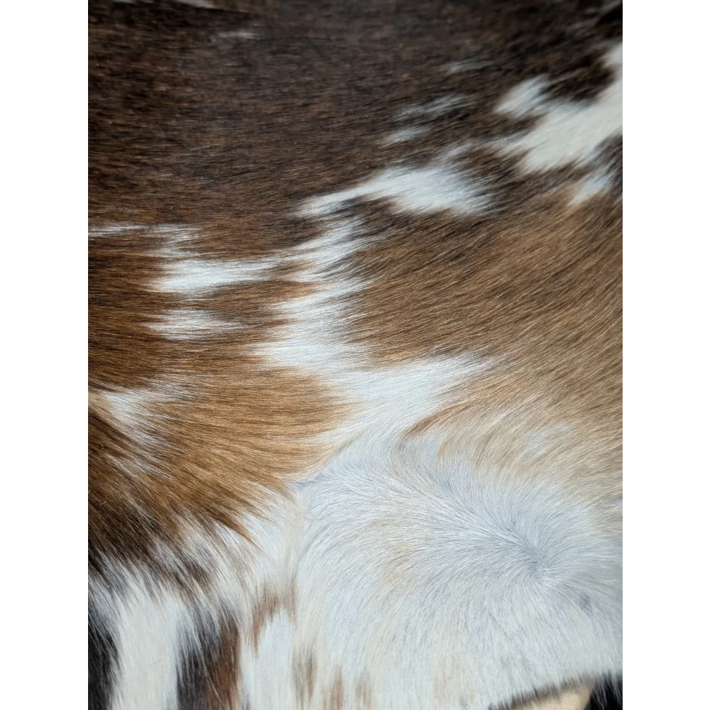 Beautiful large cowhide rug with brown and white patches, 88.5x76.5in