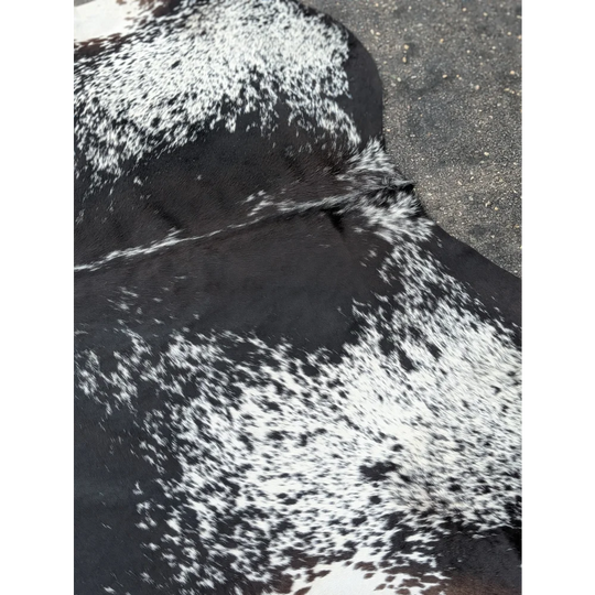 Black and white extra large cowhide rug with speckled pattern from a premium leather brand