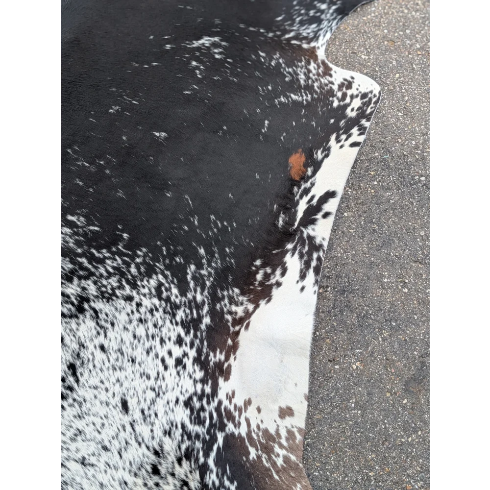 Salt & Pepper Tri large cowhide rug with black and white spots and leather texture