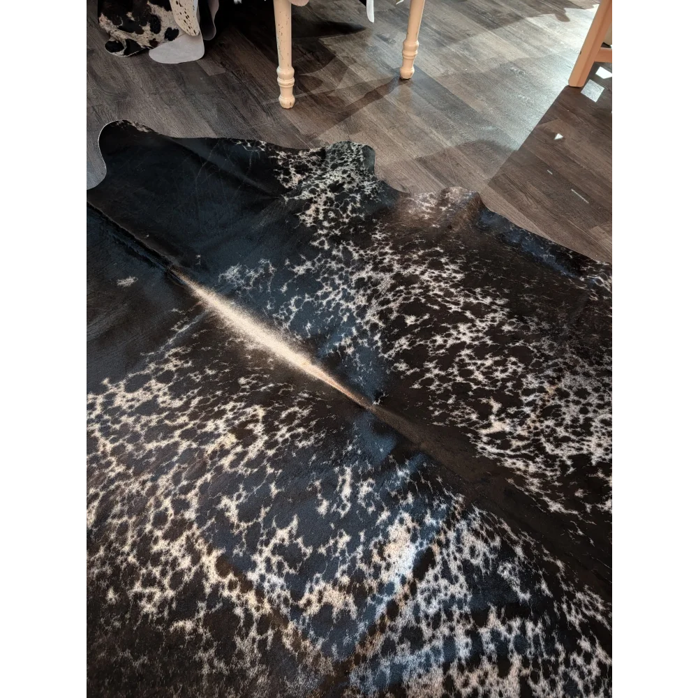 Salt and pepper tricolour extra large cowhide rug with black and white spots and natural textured surface perfect for beautiful rugs