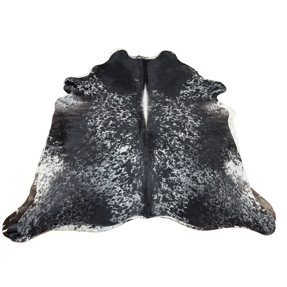 Large extra large cowhide rug in black and white spotted salt and pepper tricolour with natural irregular edges