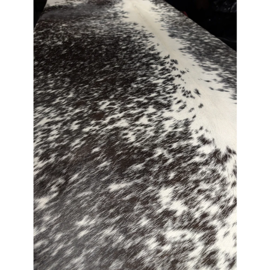 Extra large cowhide rug with black and white speckled leather texture