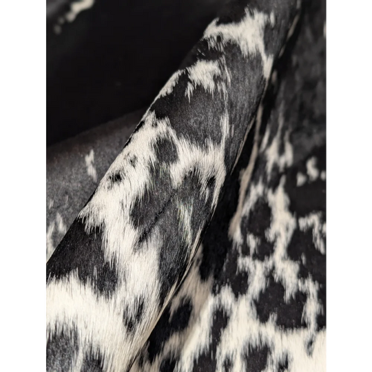 Extra large cowhide rug with black white spots, fur texture from tanning process