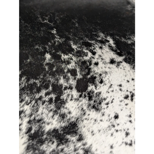Extra large black and white cowhide rug with abstract patterned texture, soft underfoot