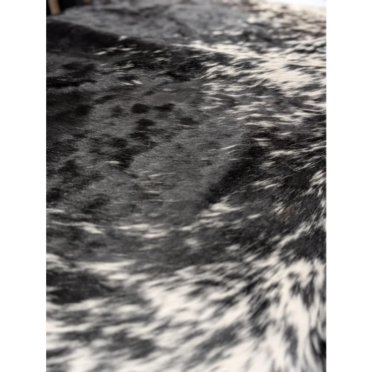 Extra large cowhide blanket with black and white speckled fur pattern, 94x88 inches