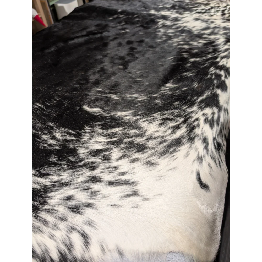 Extra large black and white cowhide blanket with speckled pattern, 94x88 inches