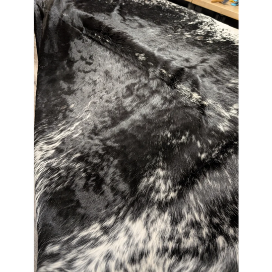 Extra large black and white cowhide rug with speckled texture, 94x88 inches