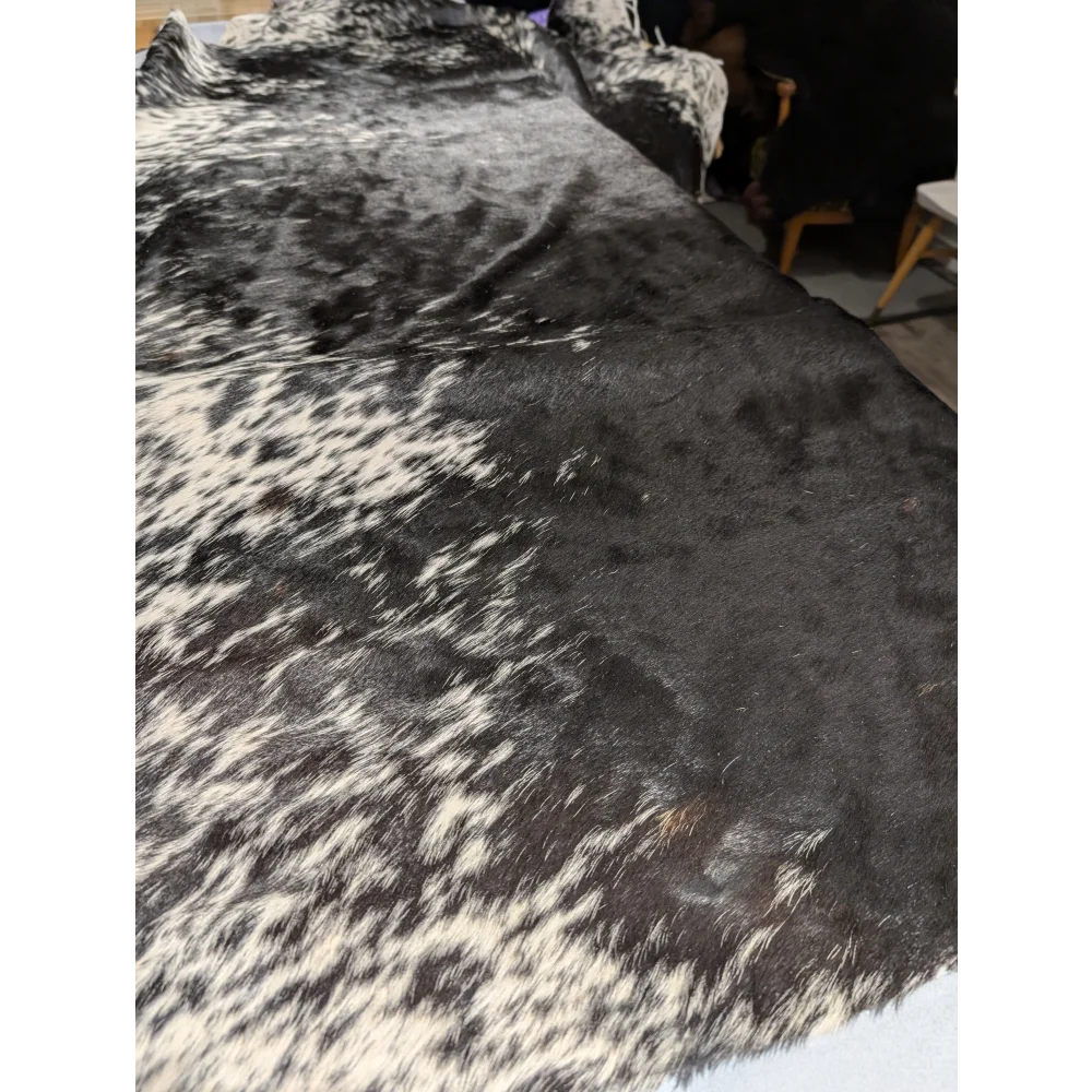 Extra large black and white cowhide rug, speckled pattern, durable tanning process